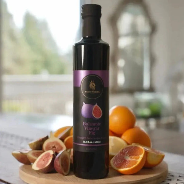 Balsamic vinegar bottle on a wooden board with fruits in a kitchen setting