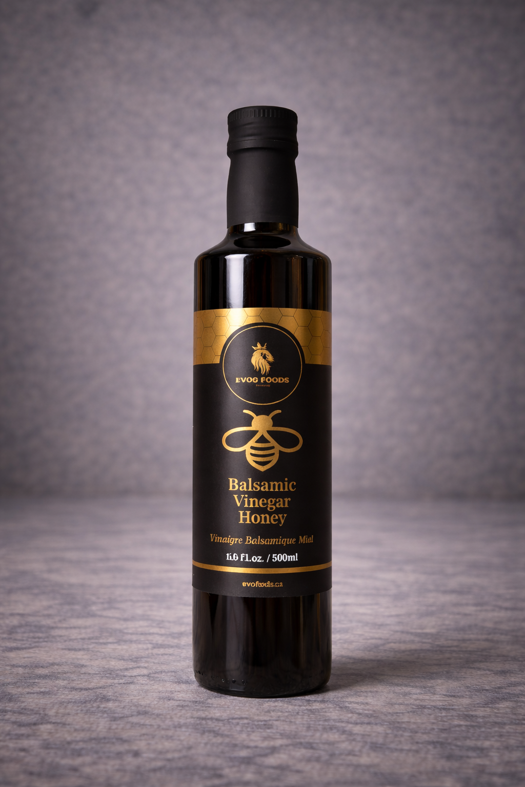 Bottle of balsamic vinegar honey on a gray background