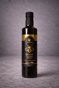 Bottle of balsamic vinegar honey on a gray background