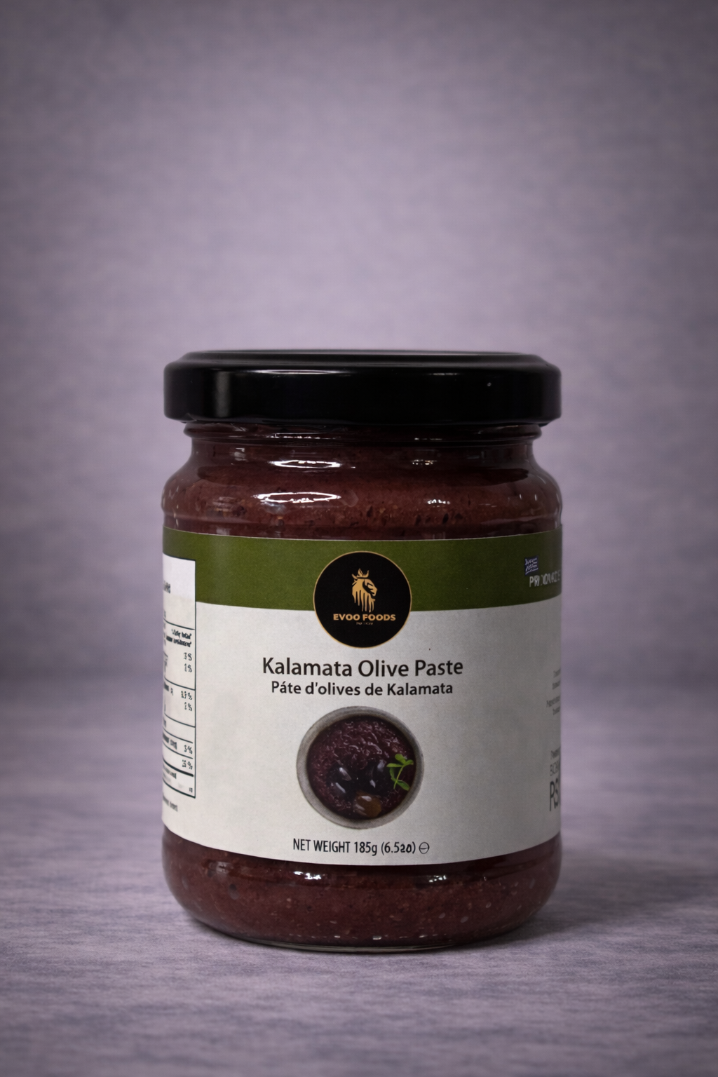 Jar of Kalamata Olive Paste on a gray background