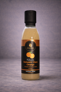 Bottle of Balsamic Glaze Orange on a gray background