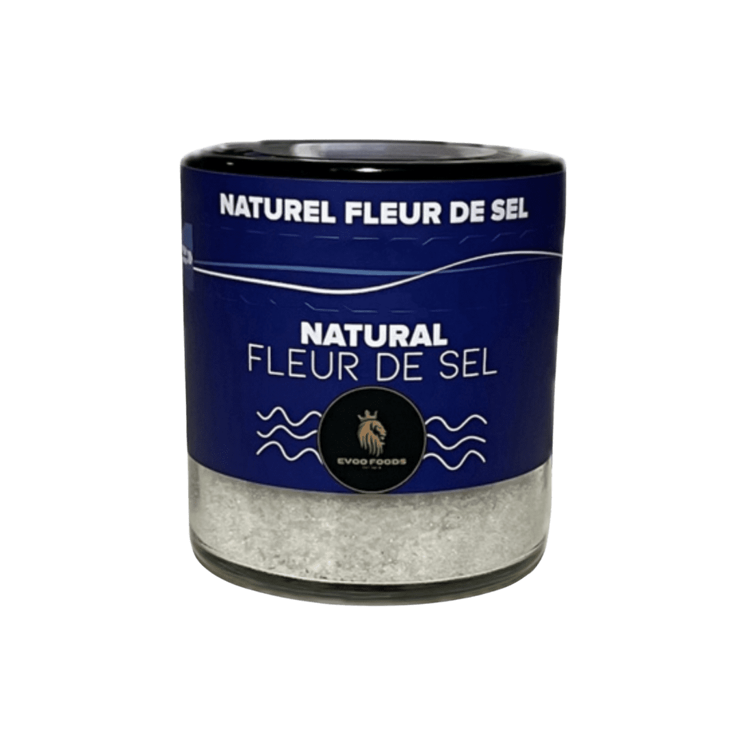 A 200g jar of Fleur De Sel Natural, a premium finishing salt from Greece, offering a delicate, flaky texture and rich flavor to elevate meats, fish, pasta, vegetables, and salads.